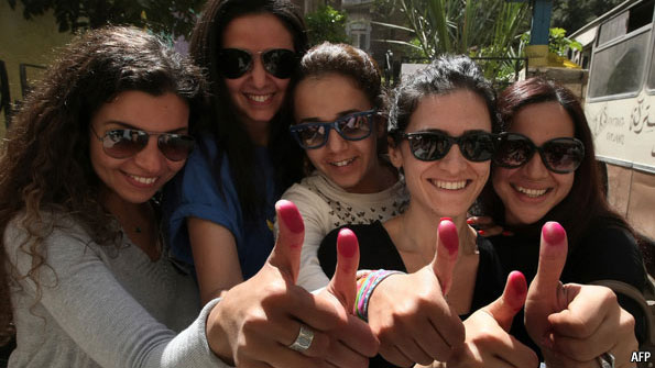 2018-02-23 Egyptian women with ink stained fingers after voting in post-revolution elections